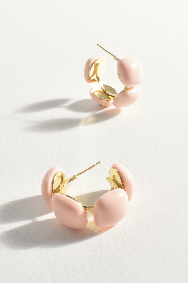 A pair of pink mini resin metal hoop earrings on a white background, with a close-up inset showing the hoop design in detail.