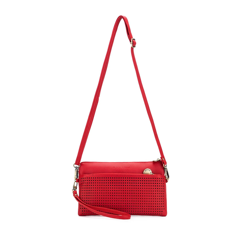 A red Nina crossbody clutch with a perforated front and a solid red back, displayed on a white background.