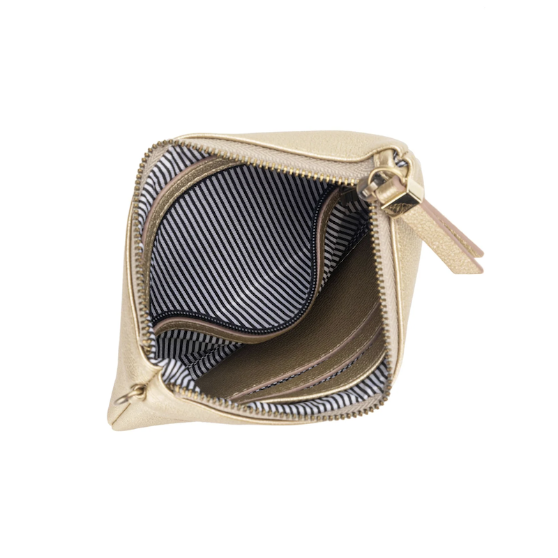 A gold-colored Stellina pouch with a metallic star detail on the front, gold hardware, and a black and white cotton wristlet strap.