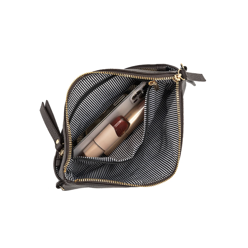 Black mesh pouch with gold zipper containing a lipstick on a white background