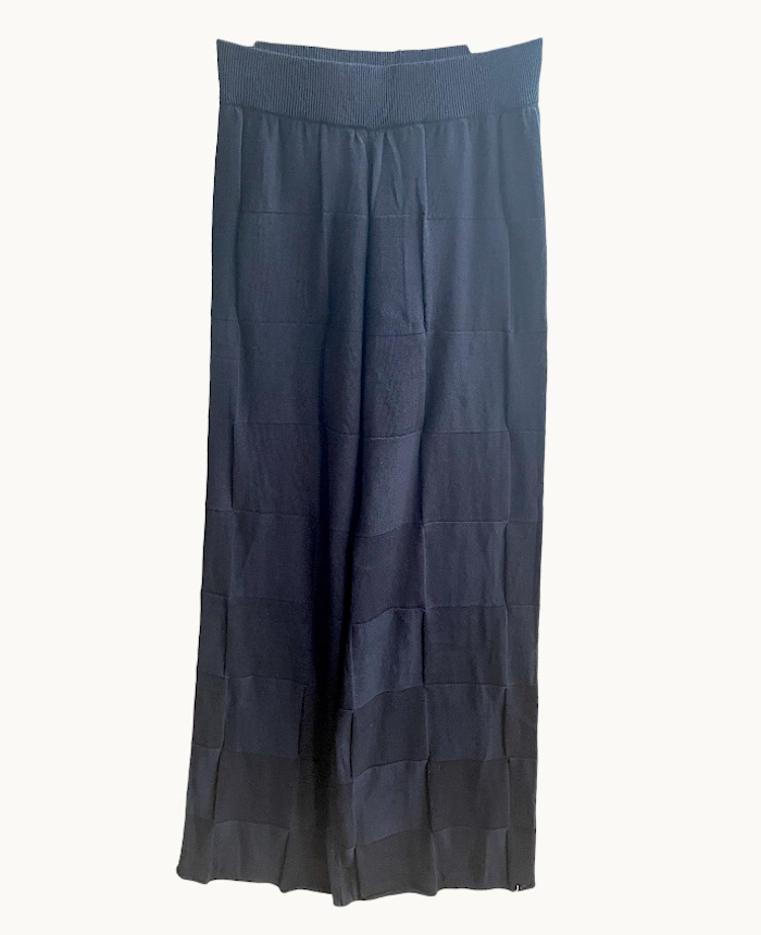 A pair of black knit pants displayed against a white background.