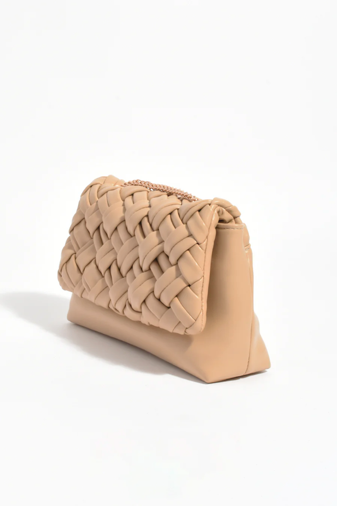 Beige woven clutch bag on a white background
