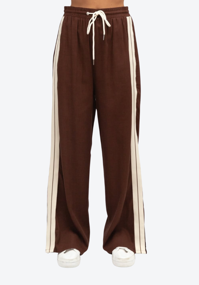 Brown sweatpants with white stripes on a white background