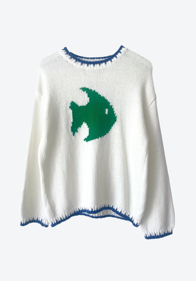 White sweater with a green fish design on a white background