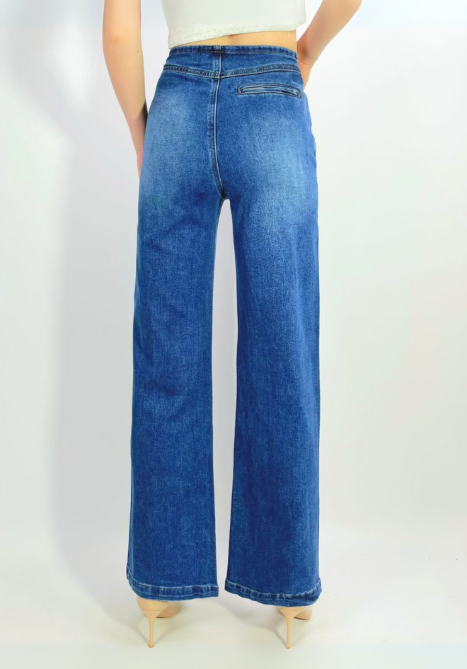 Blue jeans worn by a person on a white background
