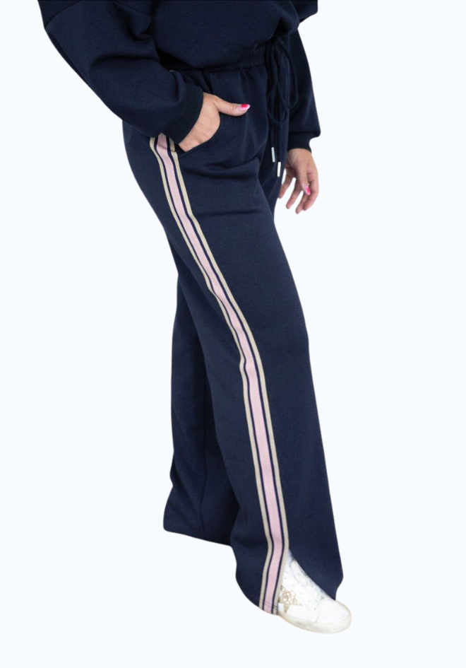 Navy tracksuit with white stripes on a white background