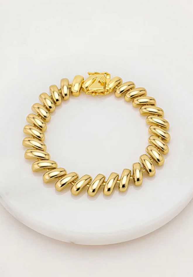 Gold bracelet on a white background