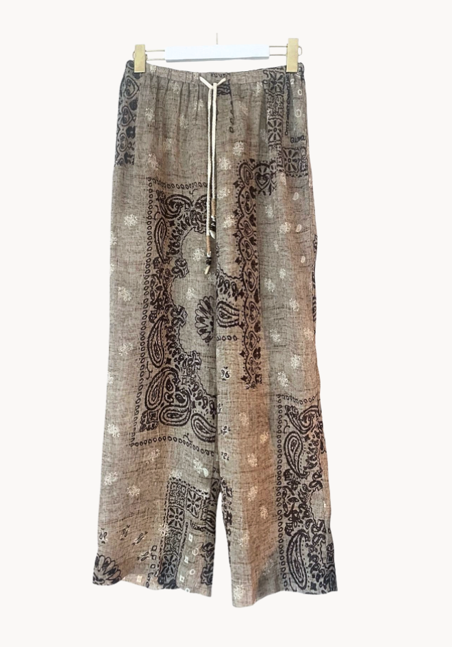 Patterned pants with drawstring on a white background