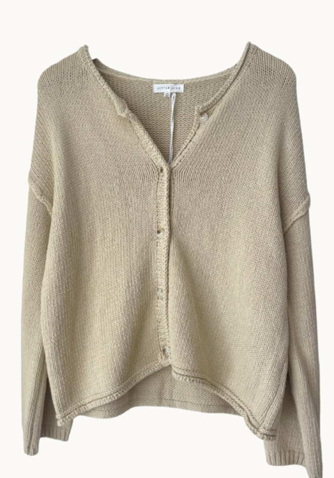 Beige knitted cardigan on a white background
