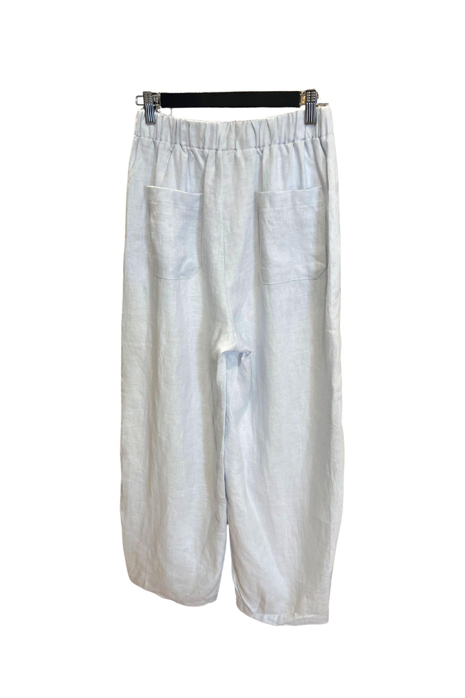 Kat and Ko Clothing Barrel Leg Linen Pants in chambray blue, back view showing the elastic waistband and patch back pockets.
