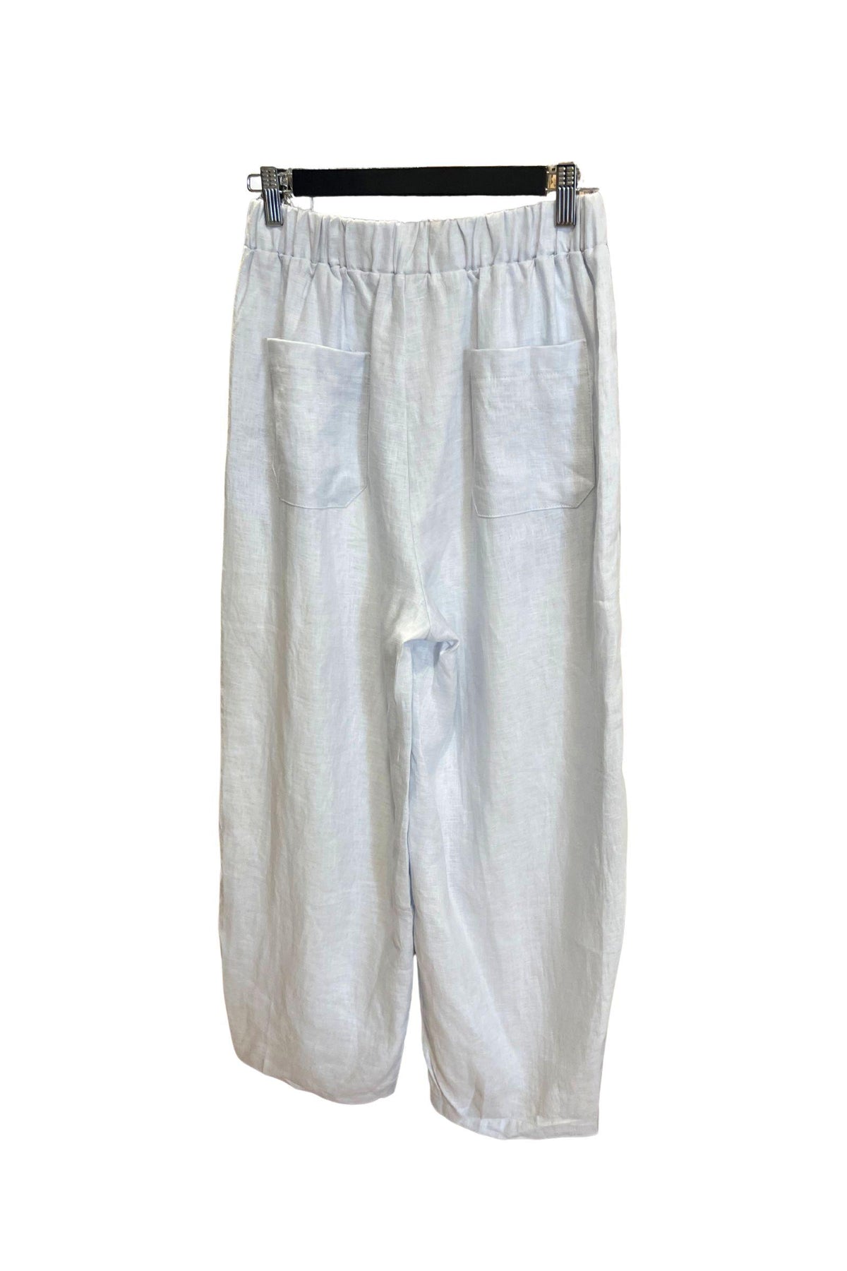 Kat and Ko Clothing Barrel Leg Linen Pants in chambray blue, back view showing the elastic waistband and patch back pockets.
