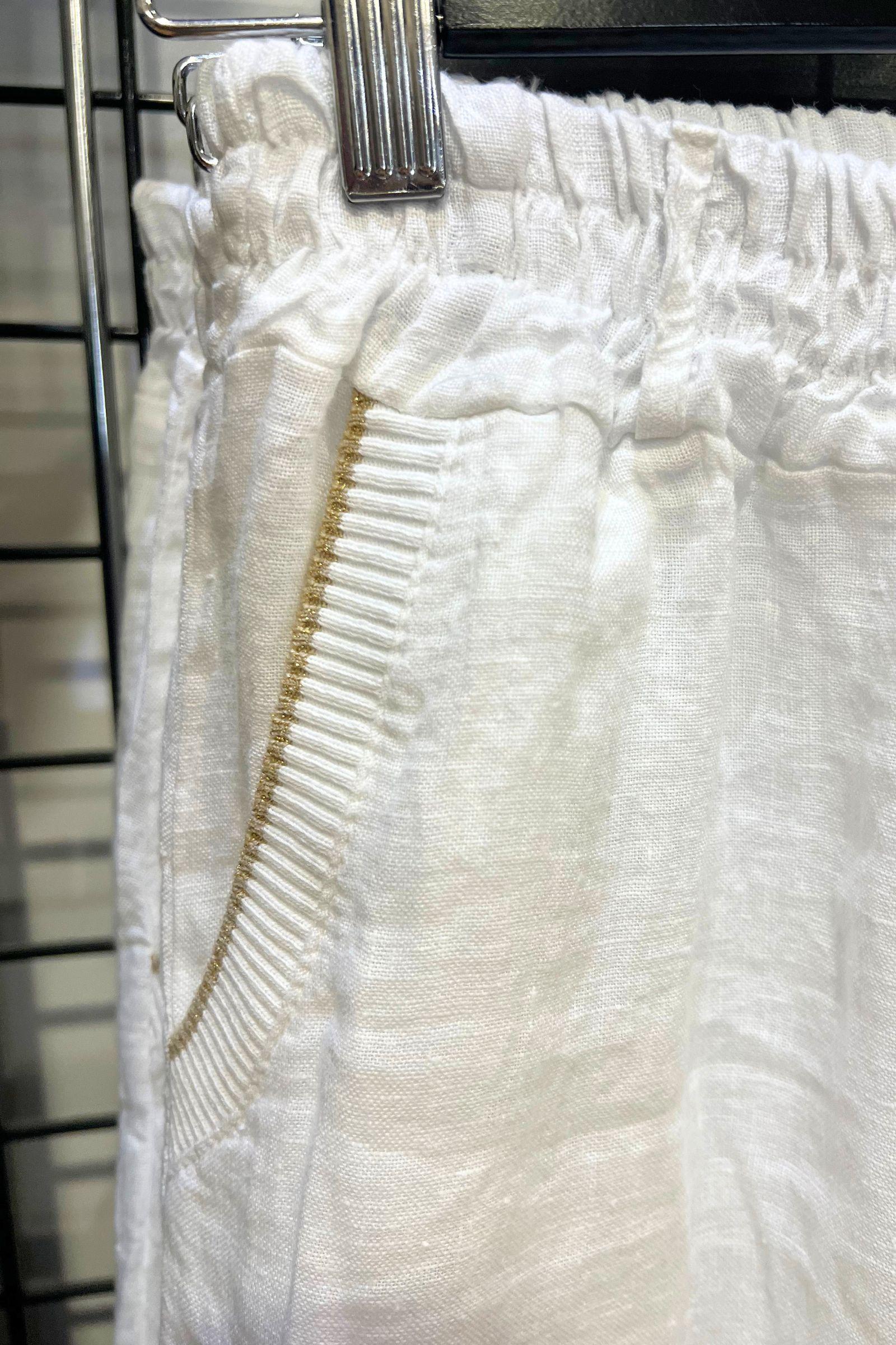 Bottega Moda Stella Linen Pants White — close-up detail of elastic waistband and gold trim pocket detail on white Italian linen fabric, shop in Australia at Kat and Ko Clothing