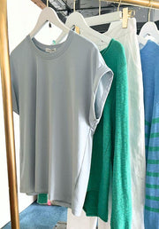 Rhodes Tee in Chambray by Little Lies — chambray blue cotton blend tee with round neckline, cuffed sleeves and straight hemline, shown on rack, available in Australia at Kat and Ko Clothing