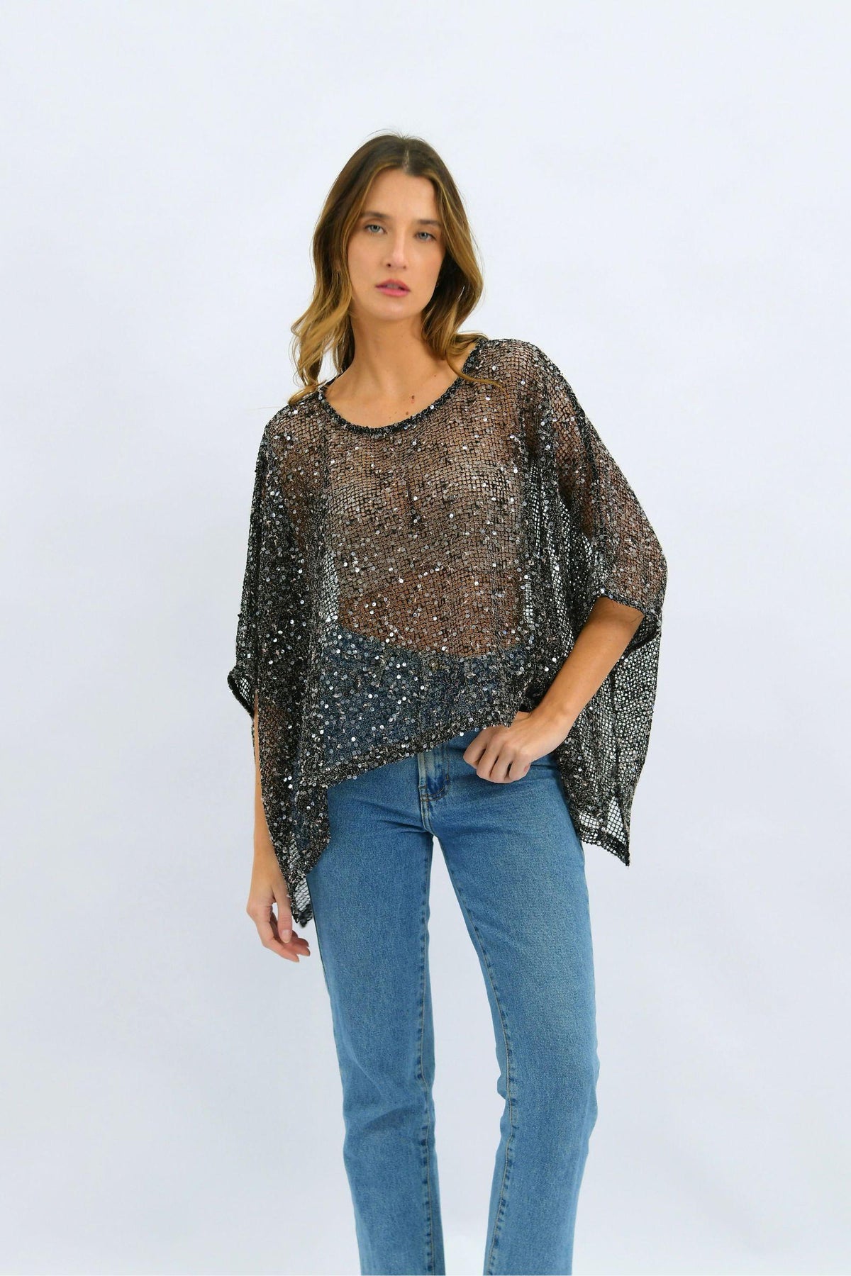 Worthier Golden Hour Sequin Top - Black — full front view of the black sequin top with relaxed silhouette and draped sleeves, styled with blue jeans, available in Australia at Kat and Ko Clothing