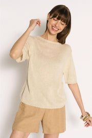 Little Lies Olivia Trim Tee in Natural smiling front view with tan shorts and gold bangles