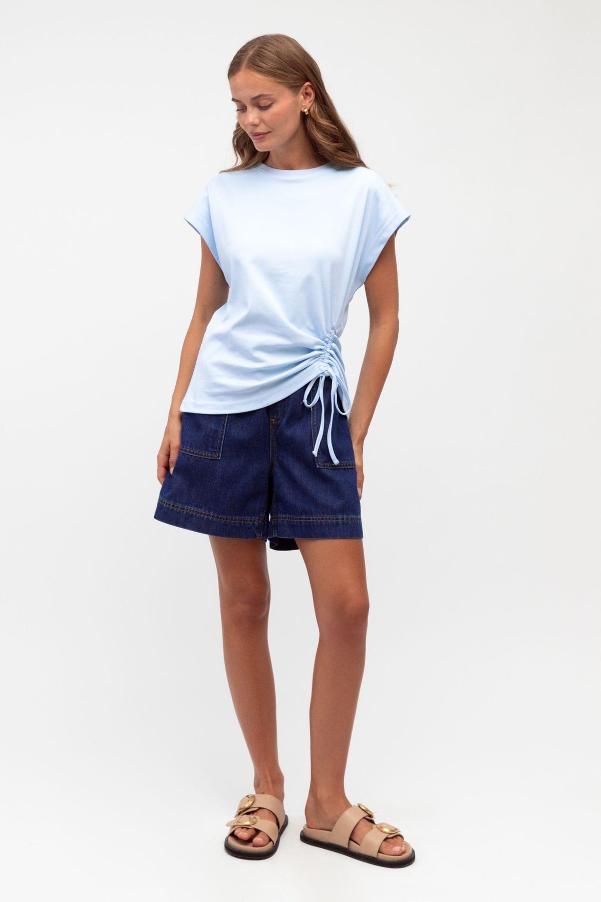 Mandy Drawstring Tee Label of Love — full-length view of the baby blue side-tie tee, styled with navy shorts and sandals, available in Australia at Kat and Ko Clothing