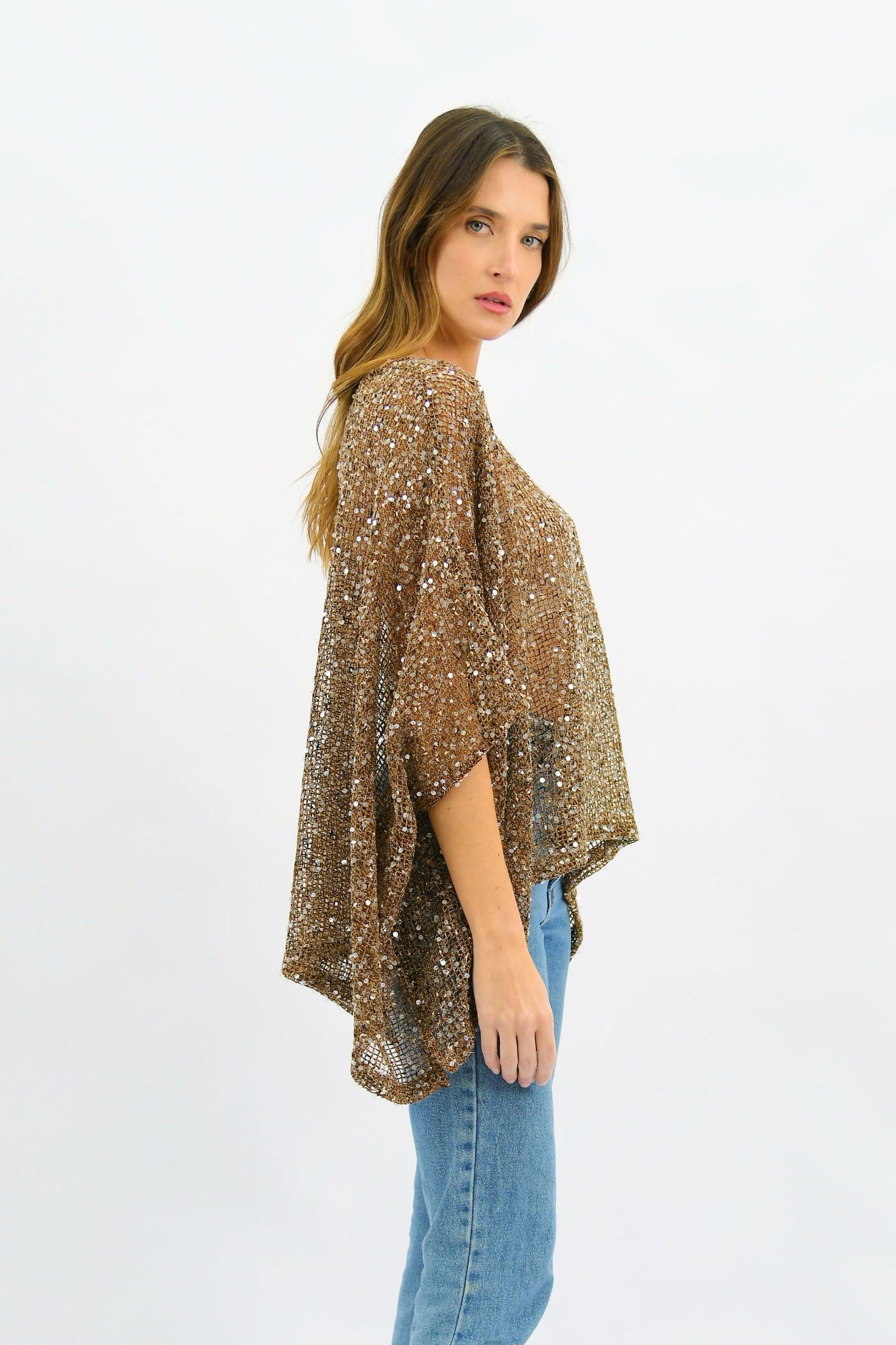 Golden Hour Sequin Top Coffee Worthier — side profile showing the dramatic batwing silhouette and all-over bronze sequin mesh fabric, styled with blue denim, shop in Australia at Kat and Ko Clothing