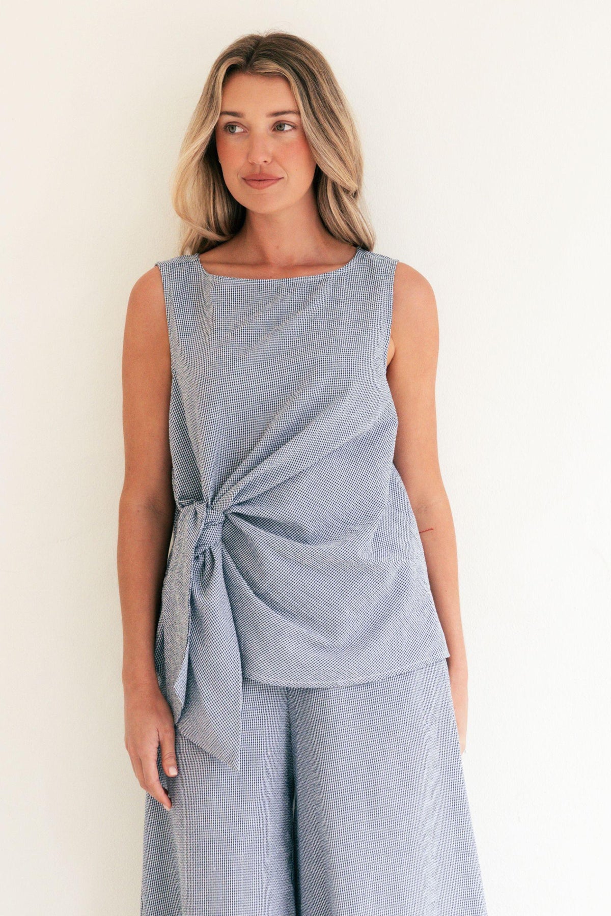 Label of Love Tie Front Check Top in Navy front close-up showing the tie front and sleeveless cut
