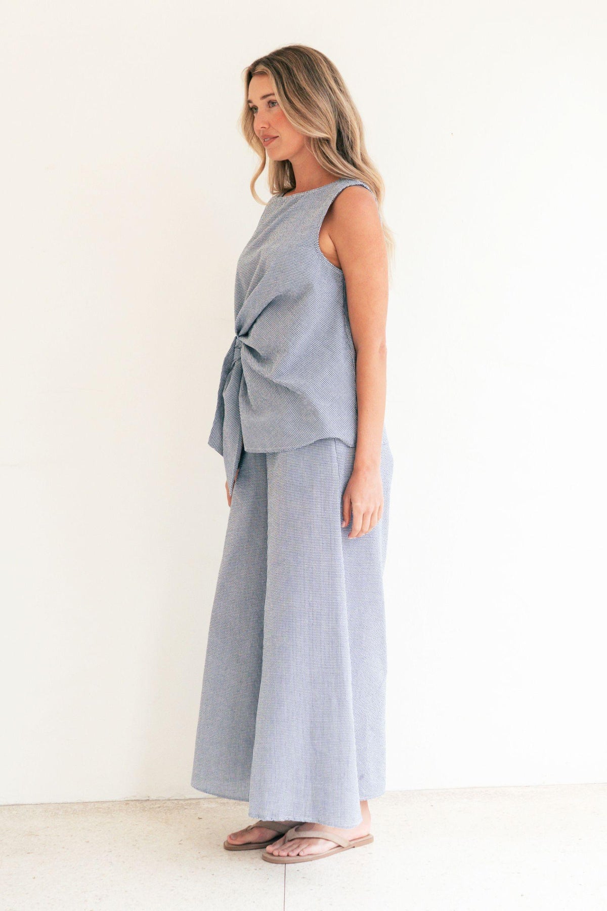 Label of Love Tie Front Check Top and Wide Leg Check Pant in Navy matching set, side view of the wide leg