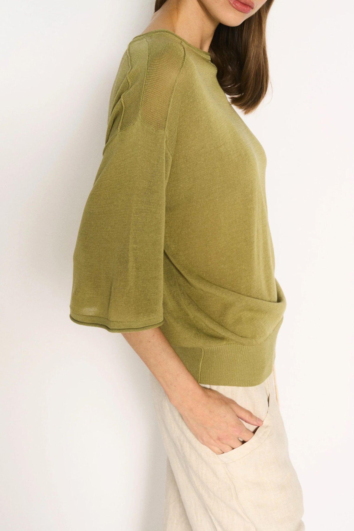 Little Lies Cassie Knit Top in Sage close-up of the loose sleeve and fine knit texture