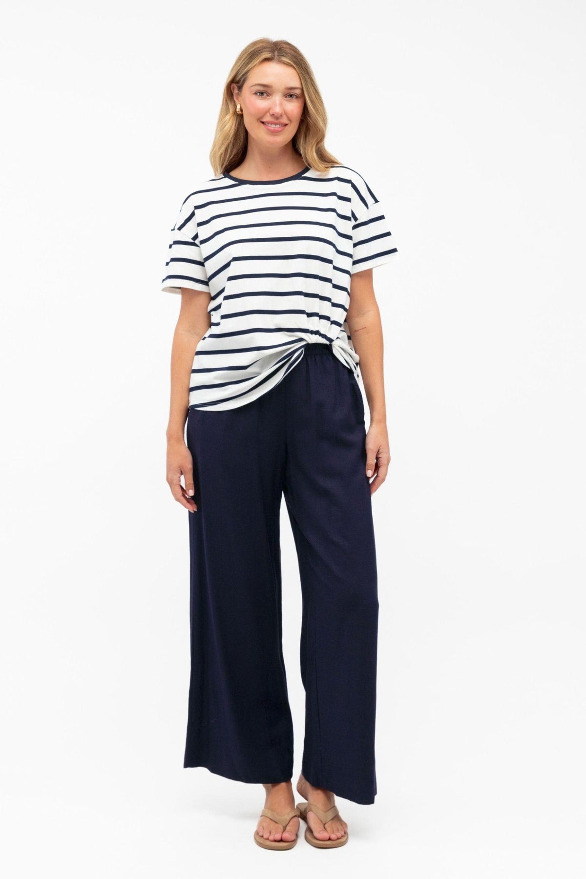 Label of Love Easy Tuck Tee — full-length view of the navy and white striped tee styled with wide-leg navy trousers, available in Australia at Kat and Ko Clothing