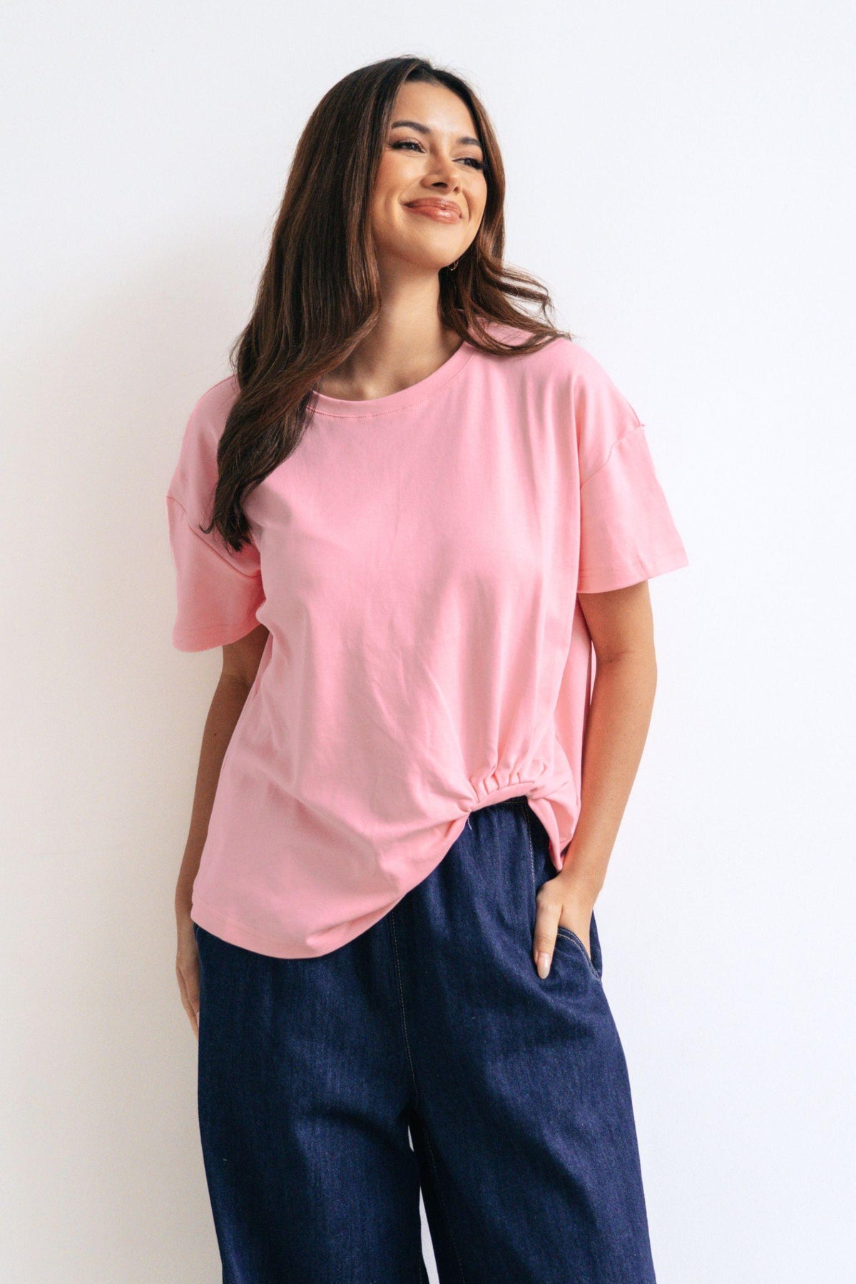 Label of Love Easy Tuck Tee in Blush, front view worn with dark denim wide-leg jeans