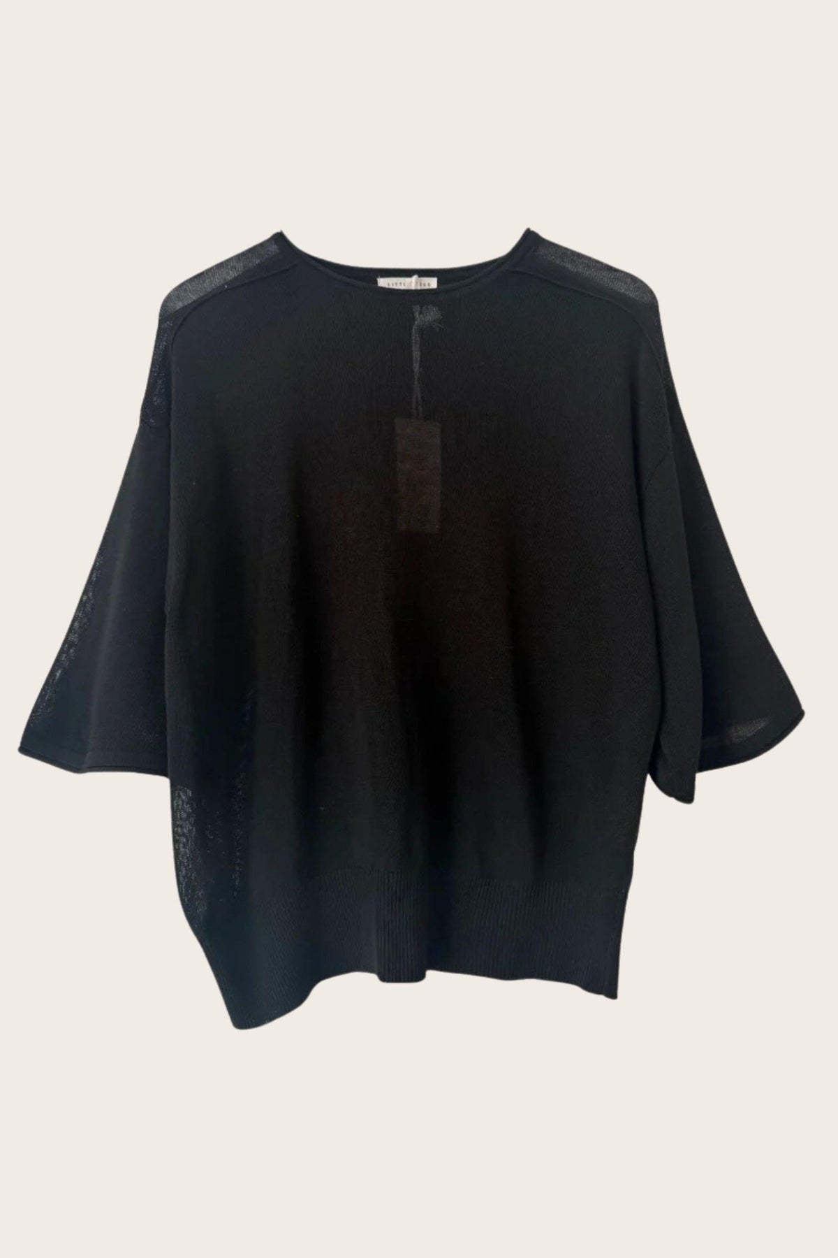 Little Lies Cassie Knit Top in Black flat front view on a plain background, showing the dropped shoulders