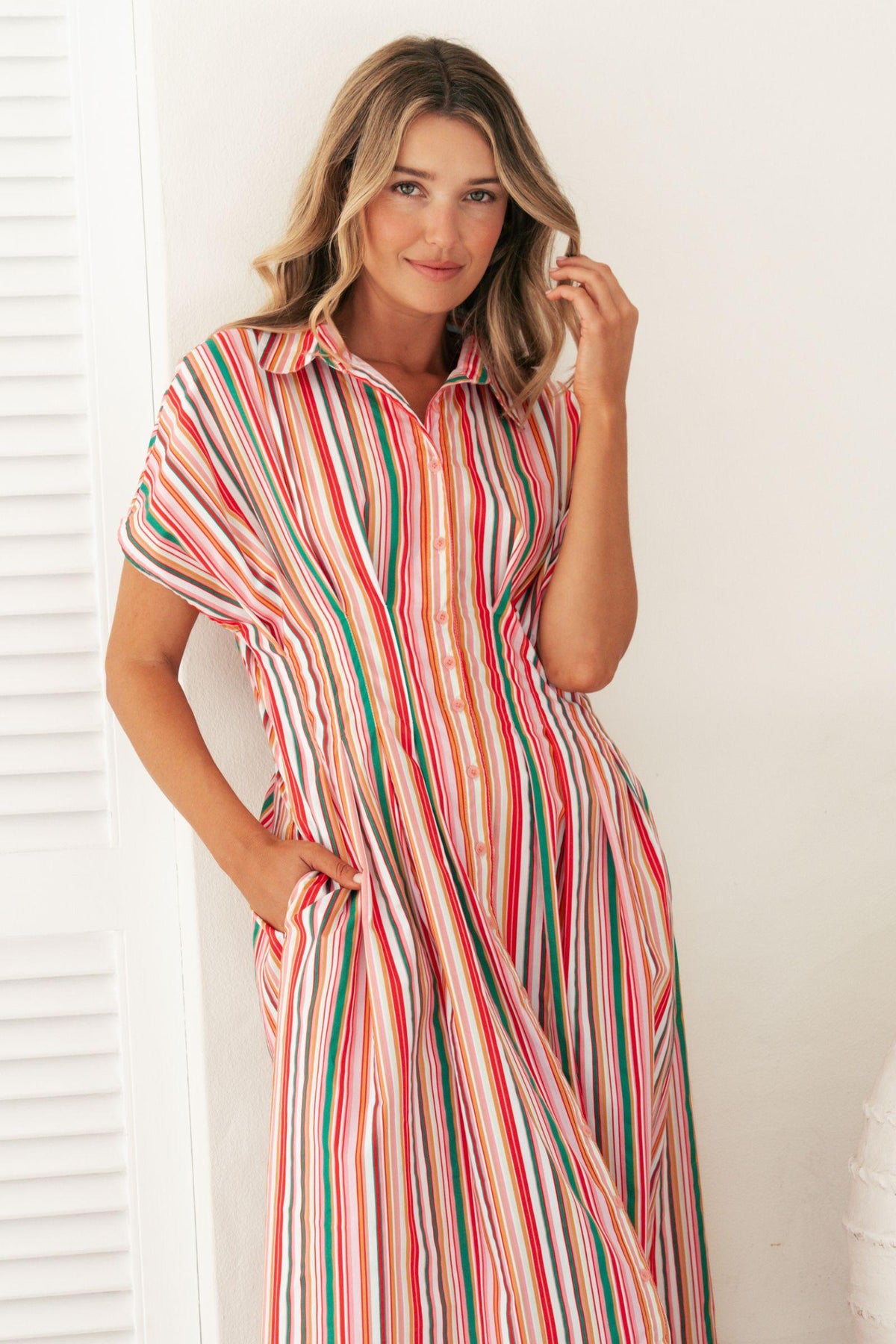 Label of Love Bella Stripe Midi Dress close-up of collar and button-through front, hand in side pocket