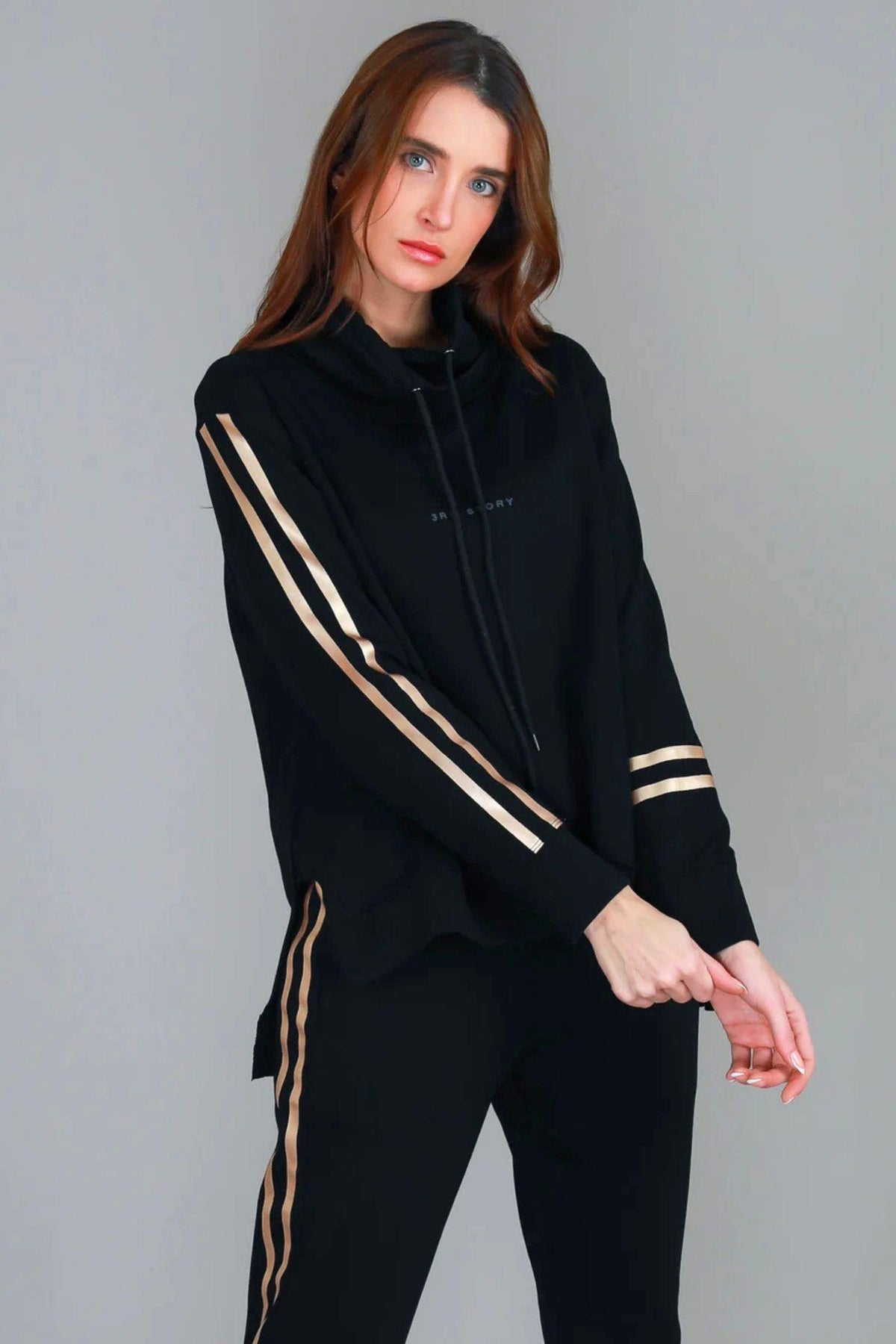 Darcy Golden Stripe Funnel Neck Sweater - Black, close side angle showing gold stripe detail