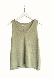 Little Lies Scoop Spring Tank in Sage front view on a hanger, showing the scoop neckline and rolled-edge hem