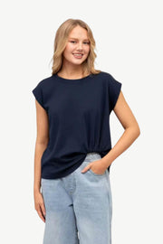 Cap Sleeve Tuck Tee in Navy by Label of Love — front view of relaxed navy tee with cap sleeves, crew neckline and subtle tuck hem detail, styled with light blue wide-leg jeans, shop in Australia at Kat and Ko Clothing