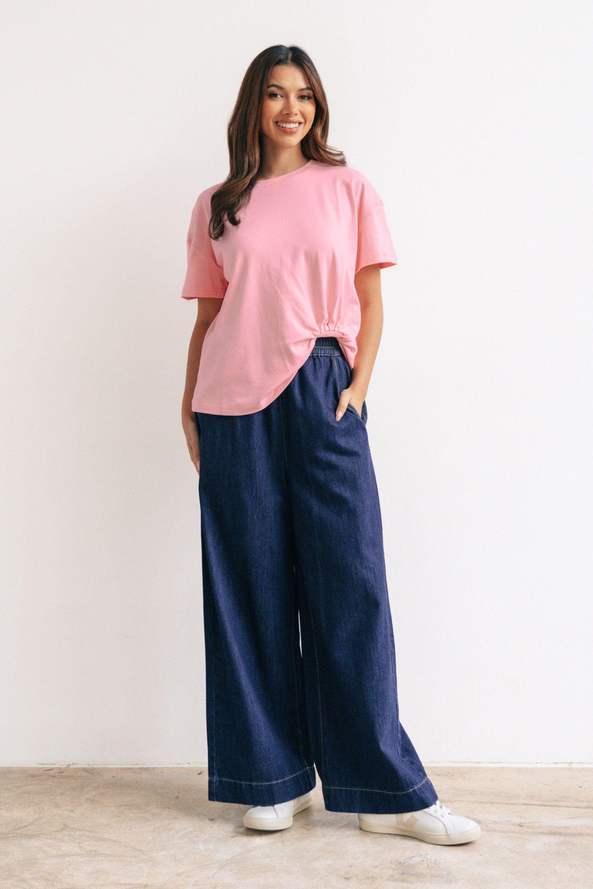 Label of Love Easy Tuck Tee in Blush, full-length with wide-leg jeans and white sneakers