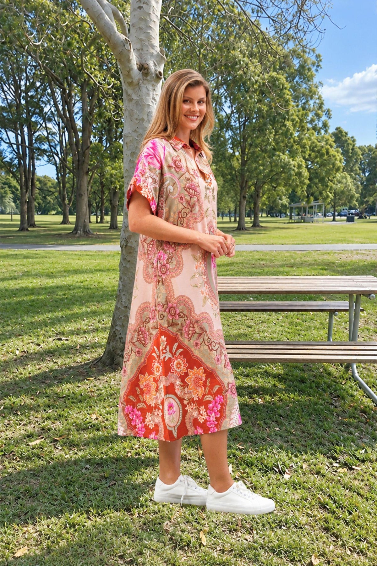 Boho Australia Fionn Midi Dress — side view of the pink patterned midi dress and flared skirt, styled with white sneakers, available in Australia at Kat and Ko Clothing