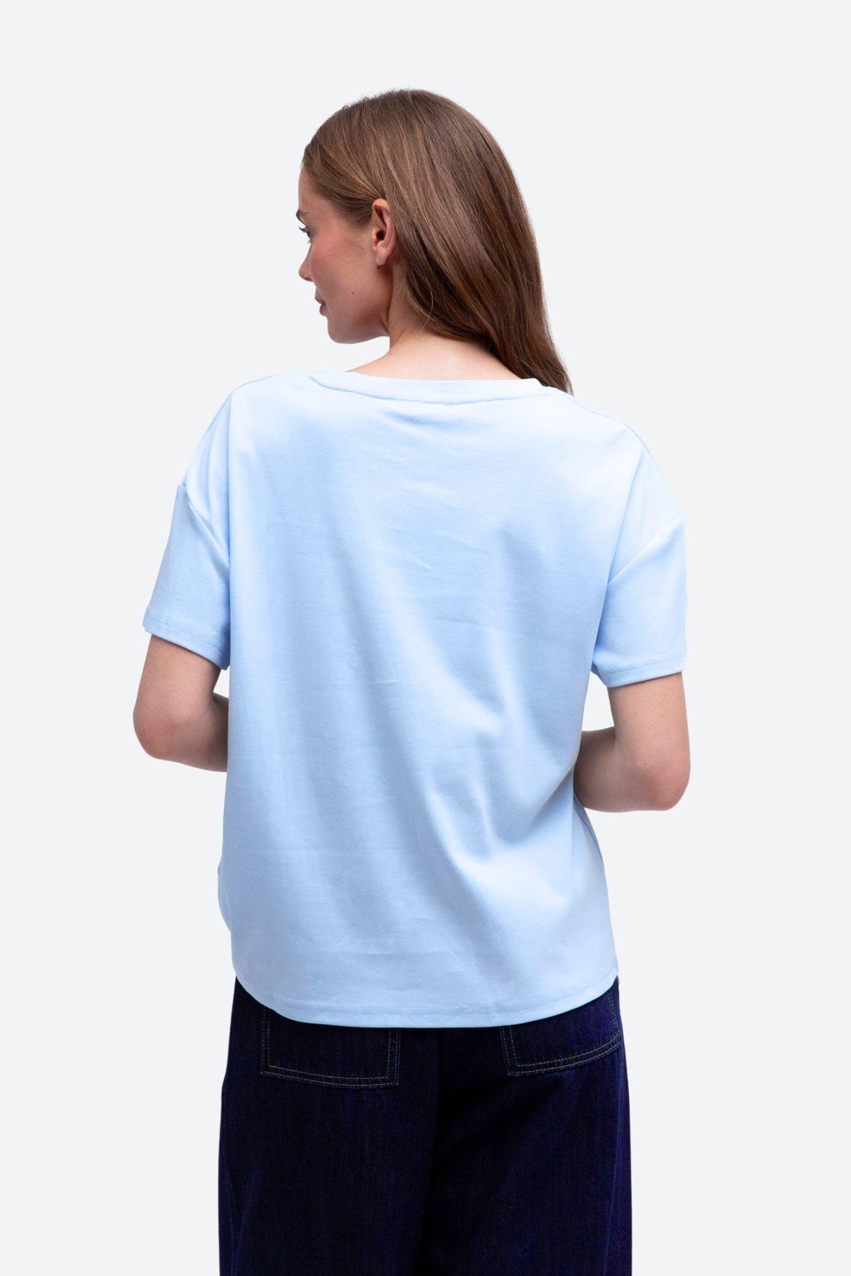 Label of Love Easy Tuck Tee in Light Blue, back view