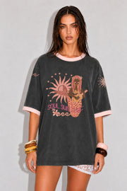 Coco Cartel Soul Sun Surf Tee in washed charcoal front view with mermaid and sun graphic and pink trims