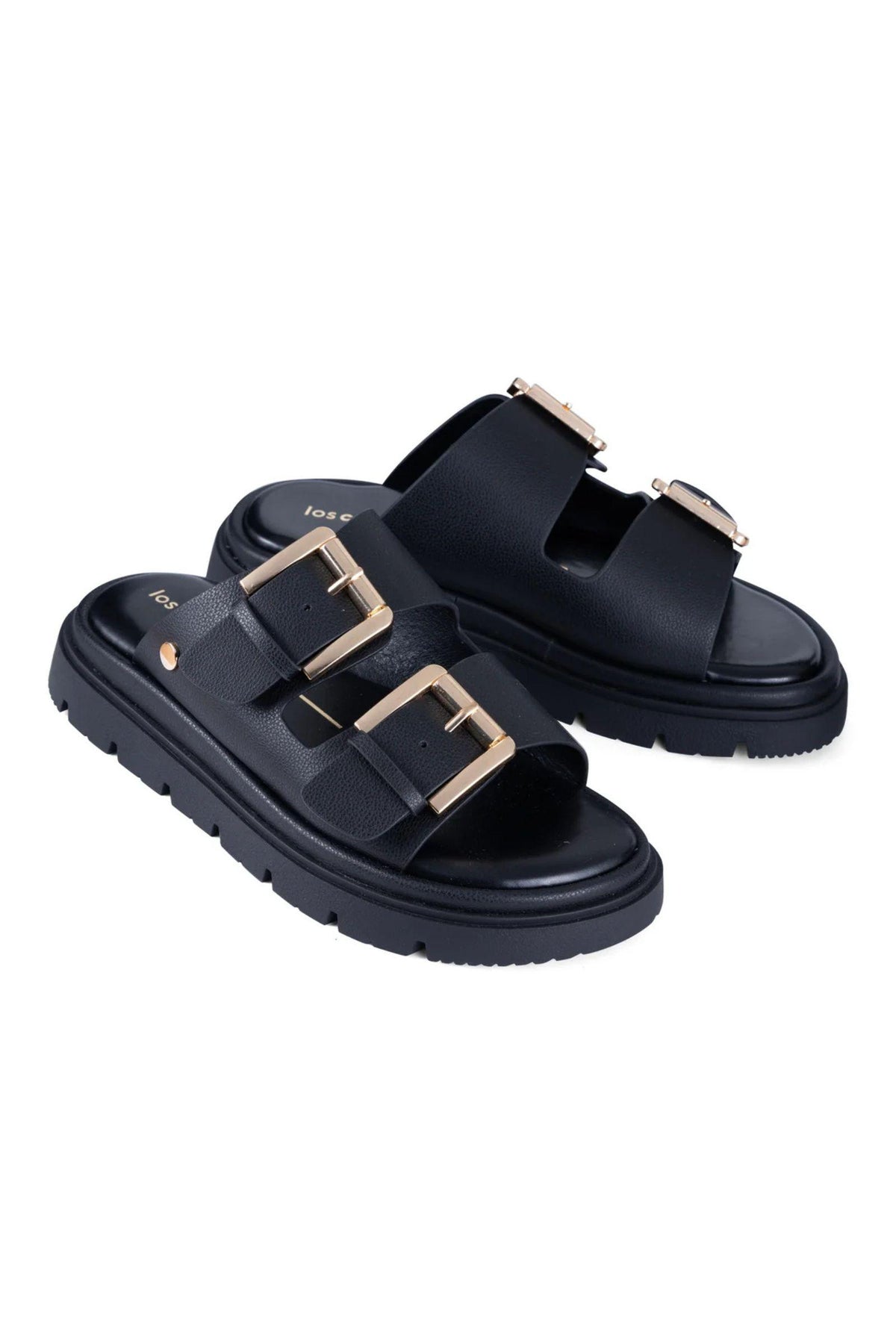 Toledo Slide in Black by Los Cabos — three-quarter view of the pair, showing the double buckle straps and lug sole