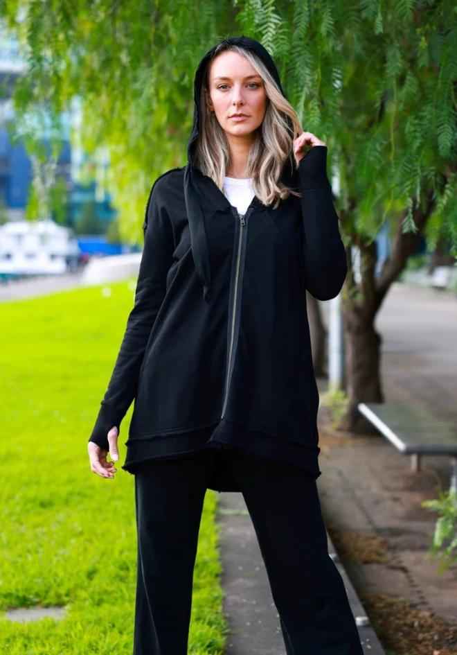 Charlie Jacket Black 3rd Story The Label — outdoor front view of black hooded longline jacket worn with hood up over a white tee and dark pants, available in Australia at Kat and Ko Clothing