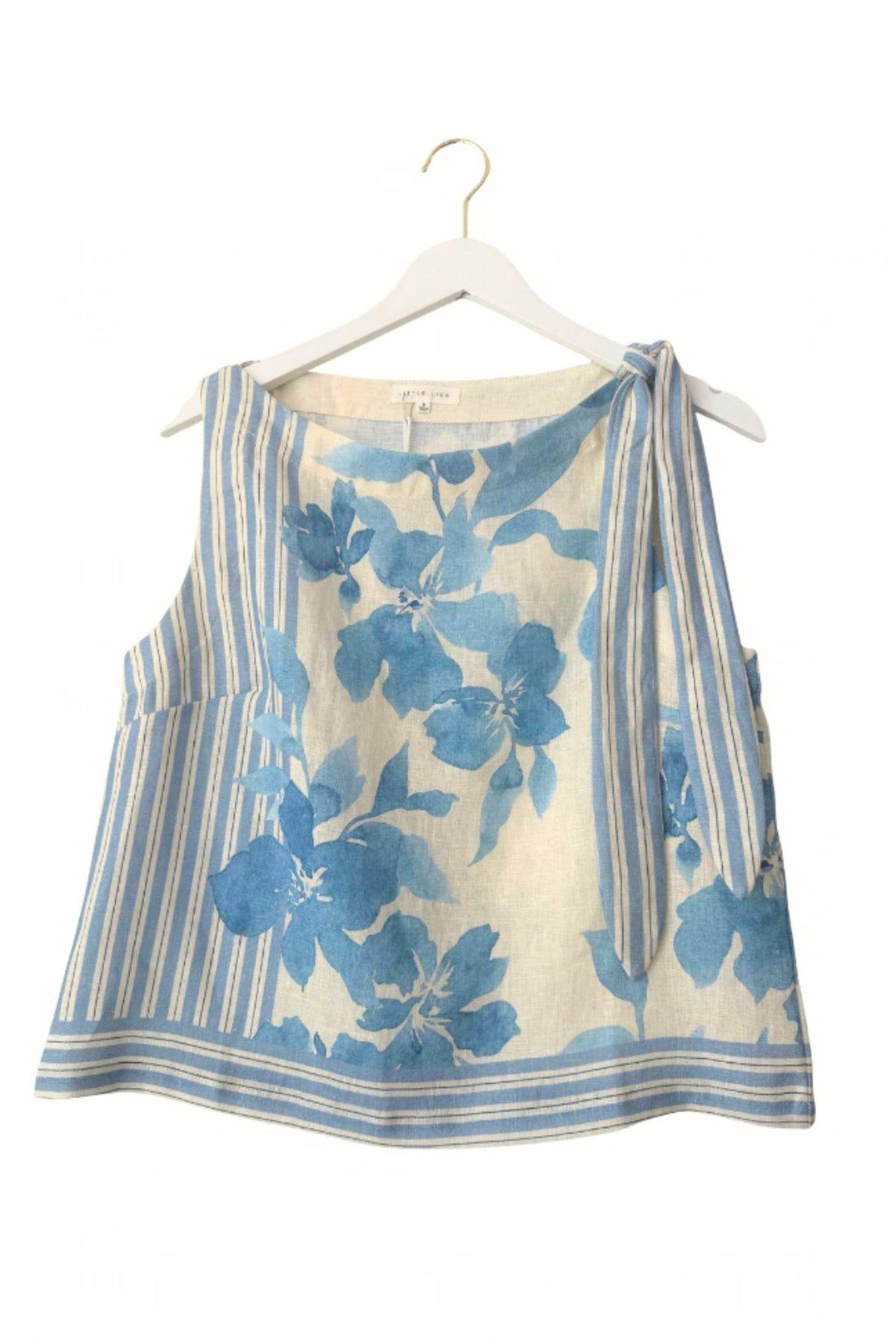 Little Lies Delphine Linen Cami — product shot of blue floral print cami with draped neckline and gathered straps on a hanger, available in Australia at Kat and Ko Clothing