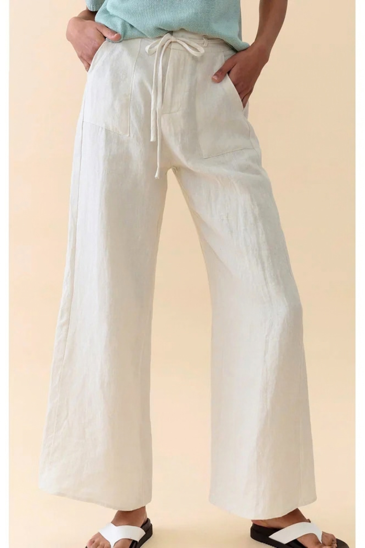 Little Lies Remy Pants — close-up of light magnolia pants showing the waistband and draped legs, available in Australia at Kat and Ko Clothing