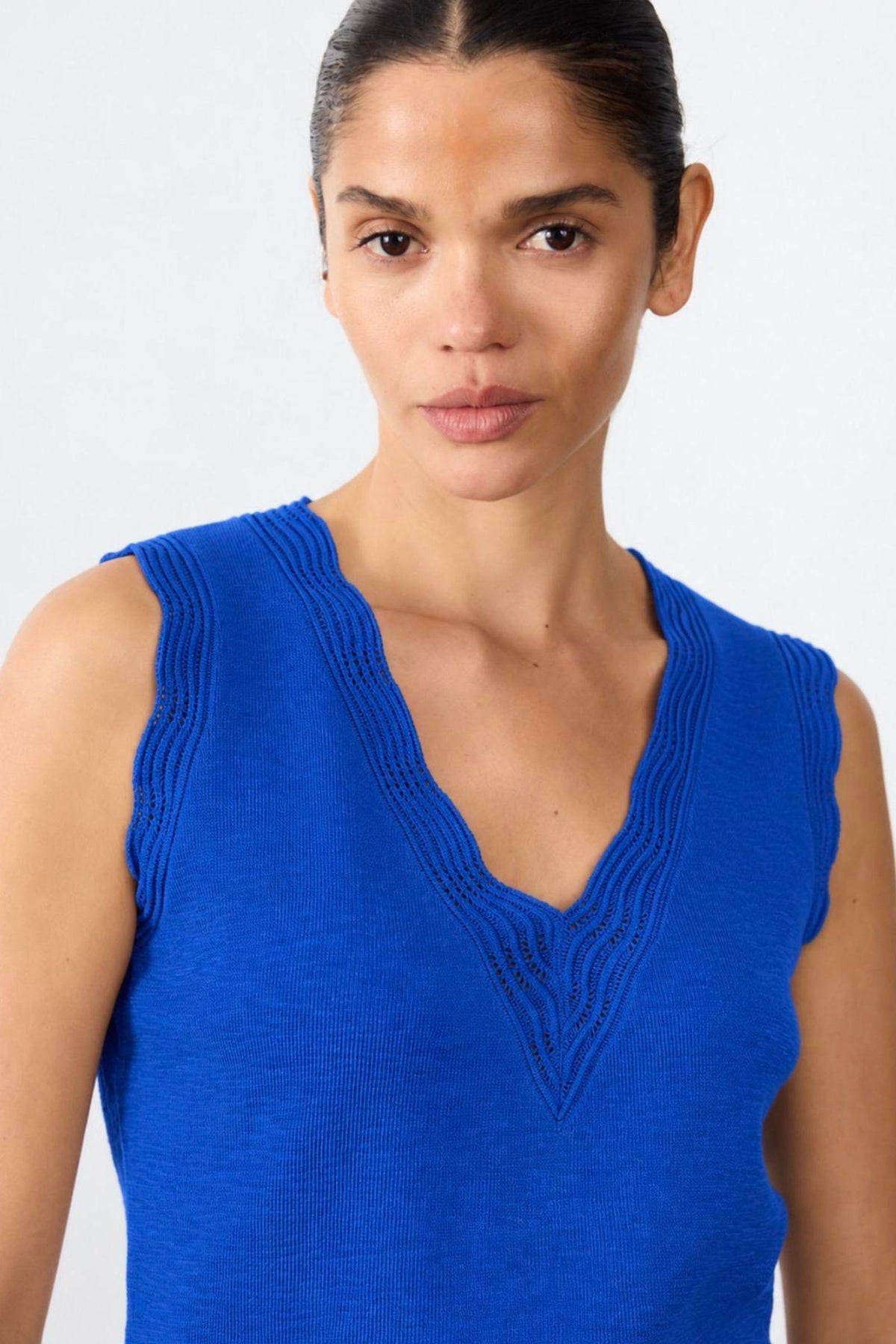 Little Lies Leila Knitted Top in Cobalt close-up of the V-neckline and scalloped edging