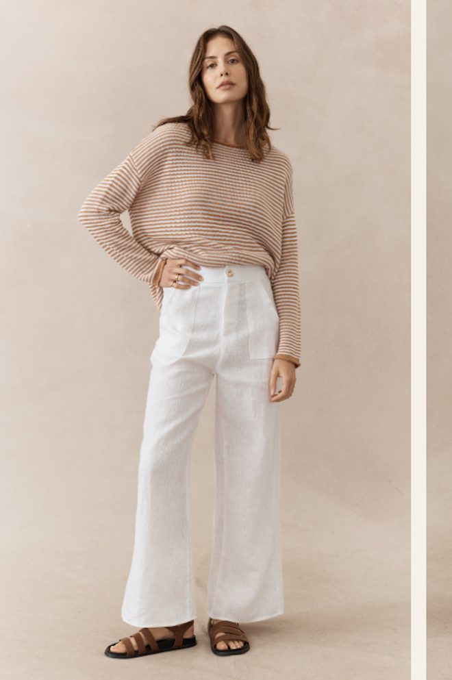 Jude Linen Pants White Little Lies — full-length front view of white wide-leg linen pants with gold button detail, styled with a neutral stripe long-sleeve top and tan leather sandals, shop in Australia at Kat and Ko Clothing