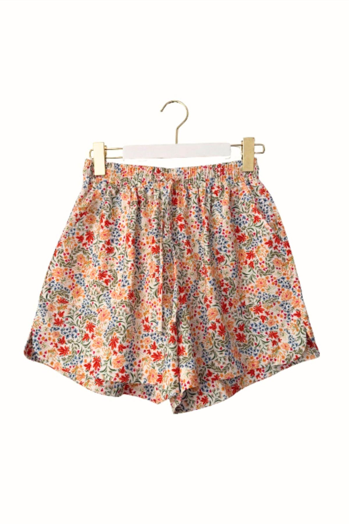 Little Lies Margot Shorts in floral print on a hanger showing the elastic waist and relaxed leg