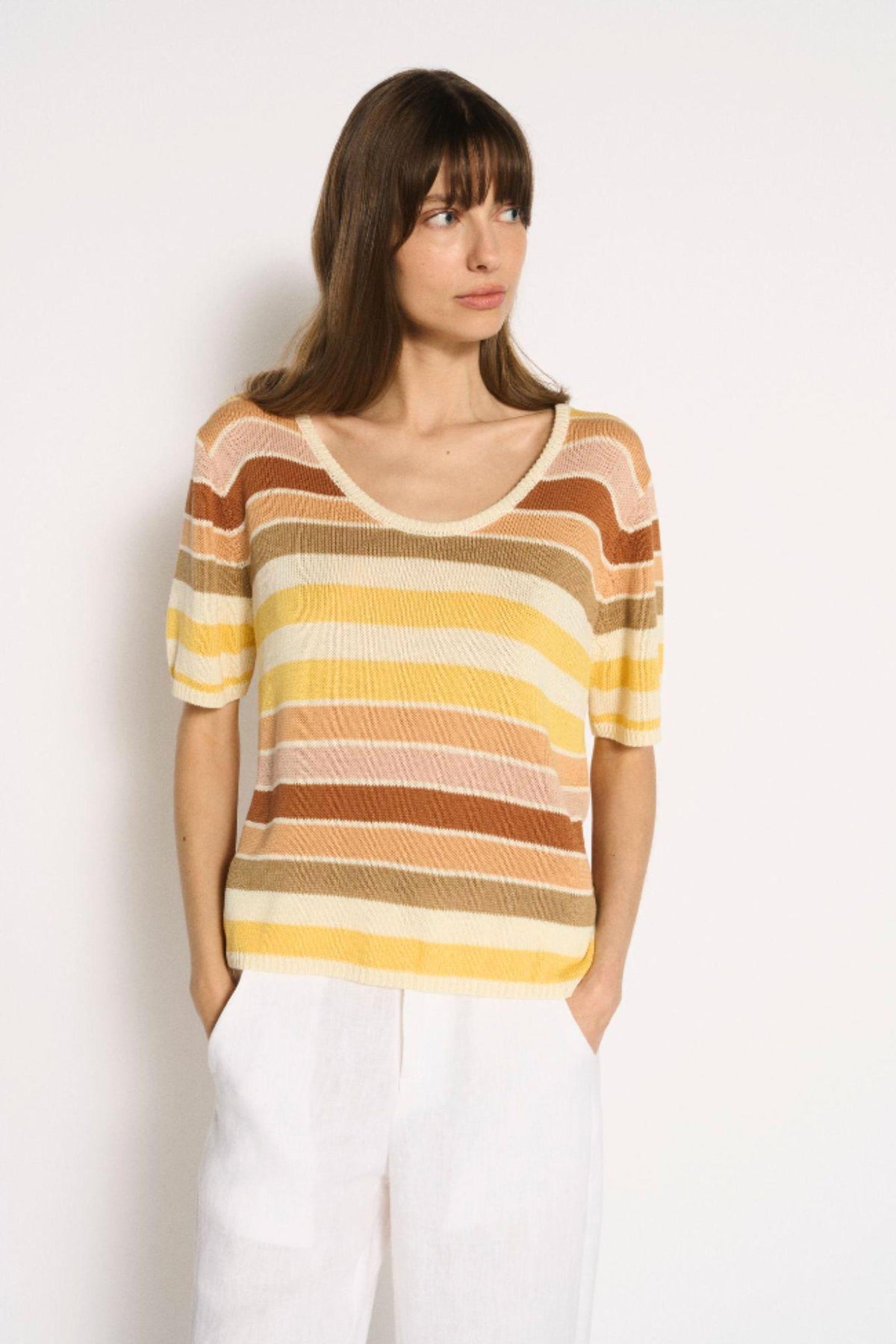 Little Lies Stevie Stripe Tee front view worn with white pants, showing the relaxed fit and dropped shoulders