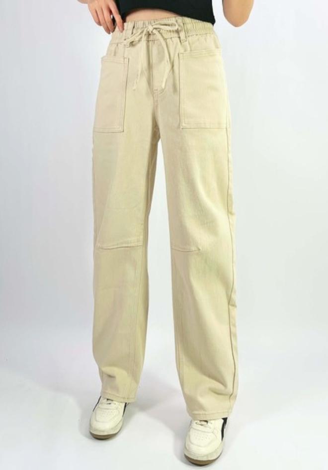 Orlando Barrel Jeans in Sand by Country Denim — front view of sand wide-leg barrel jeans with elasticated drawstring waist and large front patch pockets, styled with white sneakers, available in Australia at Kat and Ko Clothing