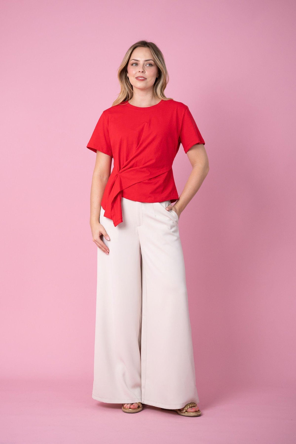 Fria The Label Ellery Tee in Red, full-length view styled with cream wide-leg pants and sandals