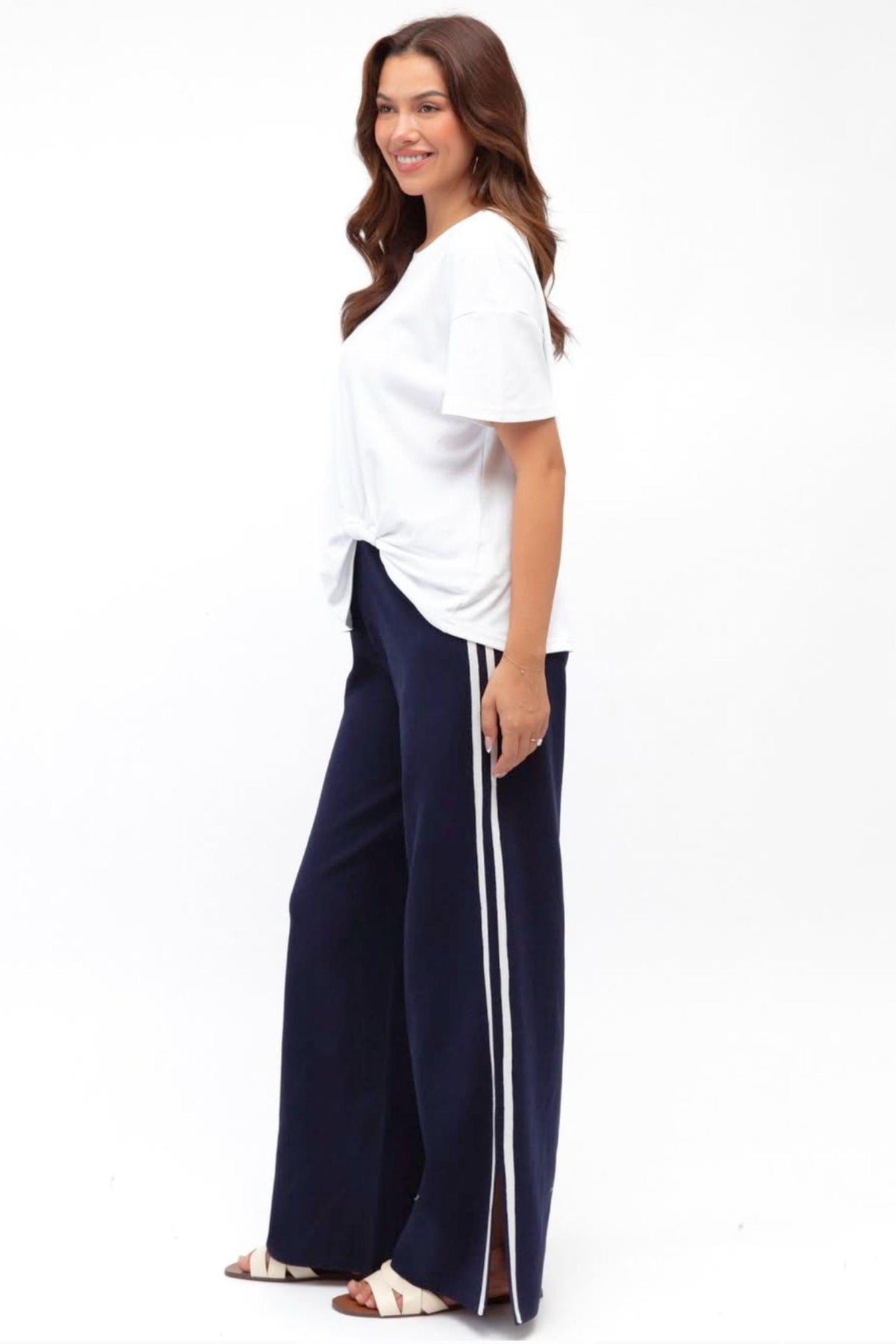 Label of Love Simba Knit Pant in Navy angled side view showing the white side stripe and wide leg