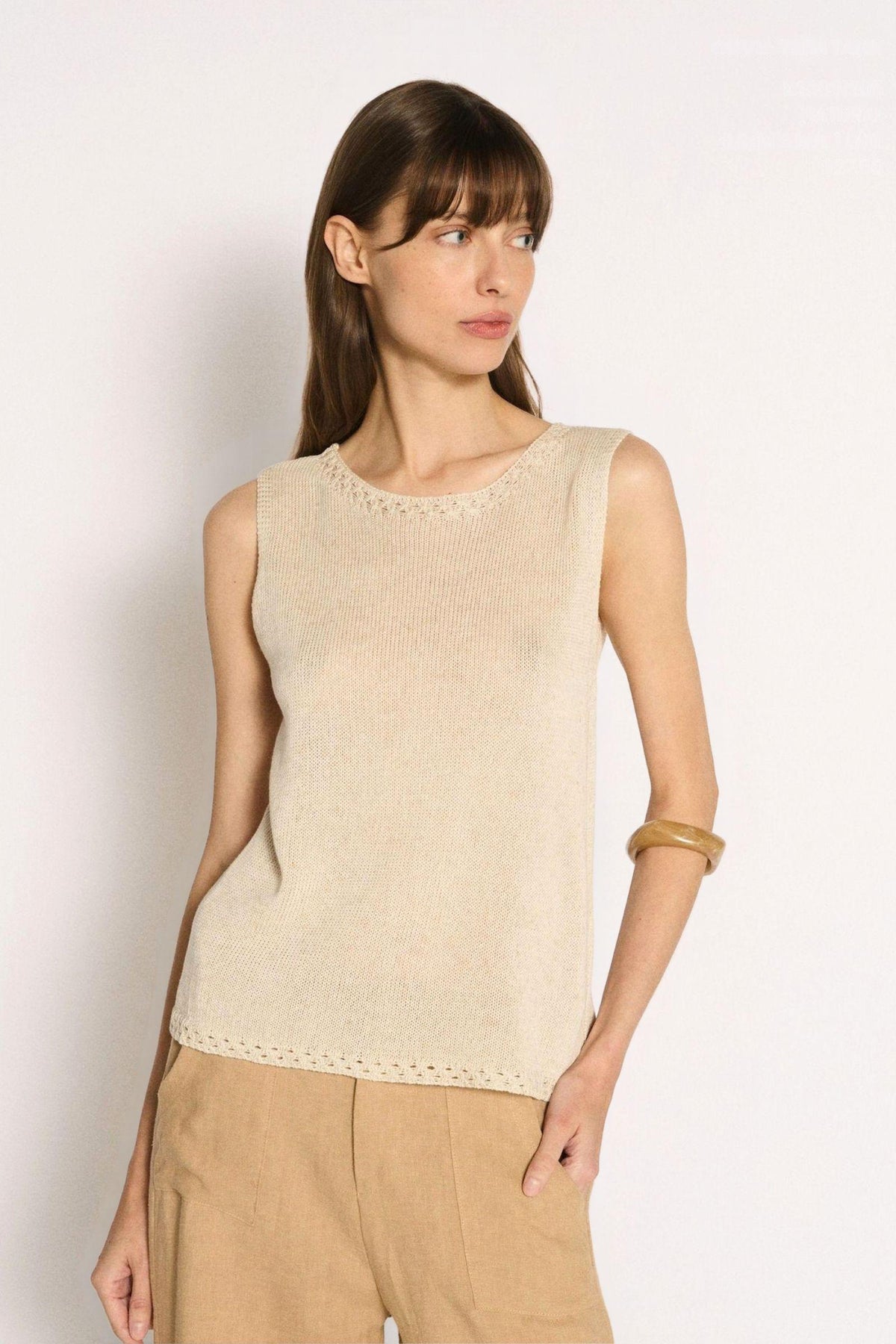 Little Lies Olivia Trim Tank in Natural angled front view with tan pants and a gold cuff