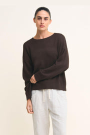 Victoria Jumper in Chocolate by Little Lies — cropped front view of chocolate brown relaxed knit jumper with boat neckline and long sleeves, styled with white drawstring linen pants, available in Australia at Kat and Ko Clothing