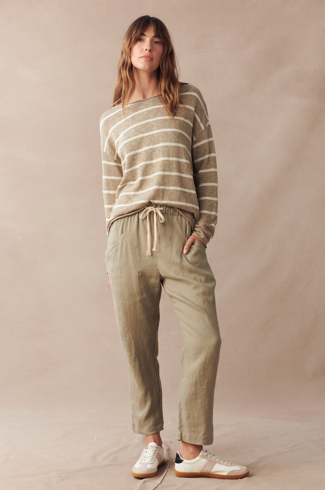 Little Lies Luxe Pant Khaki — full-length front view of relaxed khaki linen pants with rope tie waist, styled with a striped knit top and white sneakers, shop in Australia at Kat and Ko Clothing
