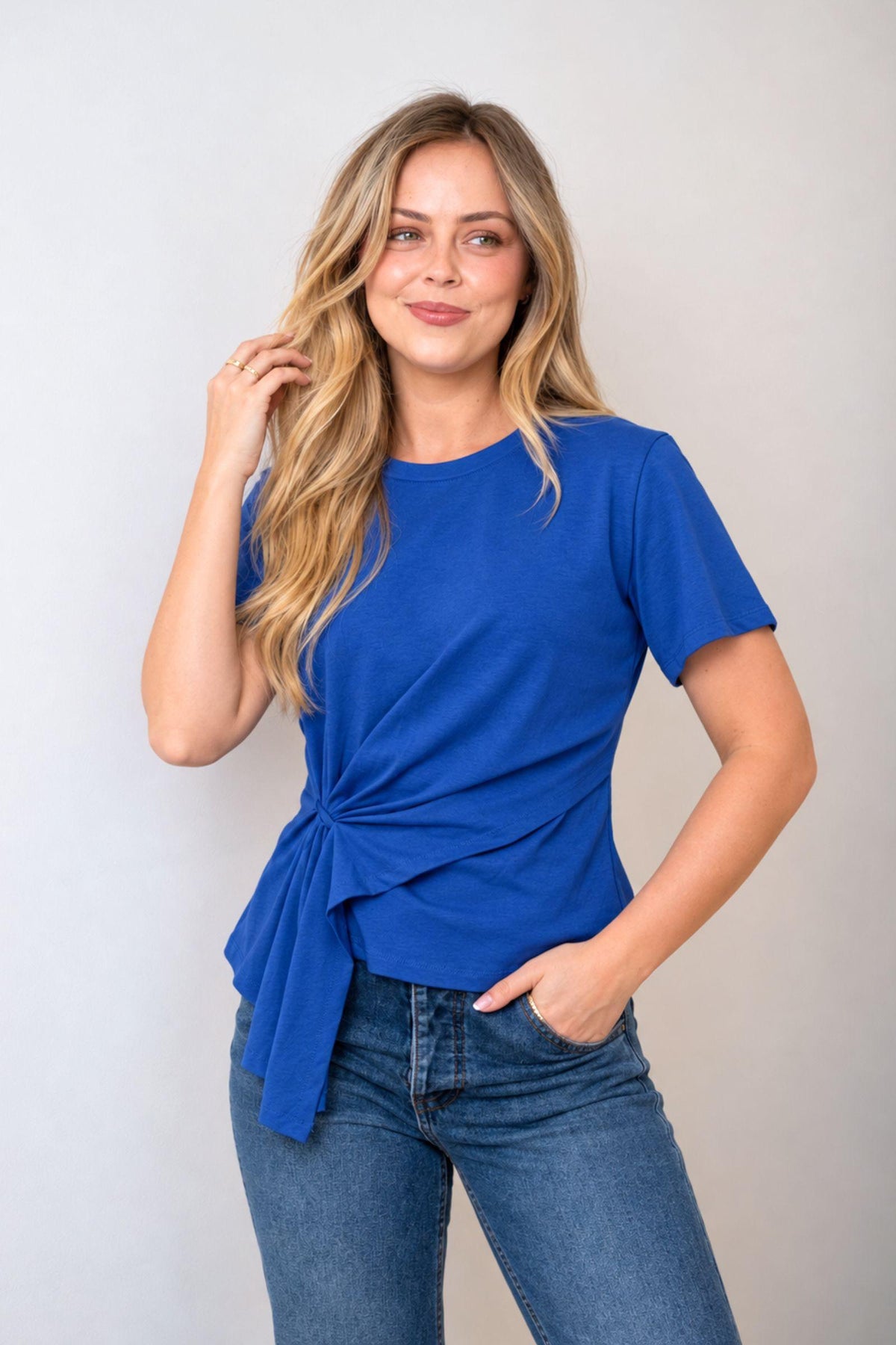 Fria The Label Ellery Ring Detail Tee in Cobalt Blue with gathered ring side detail, worn with blue jeans